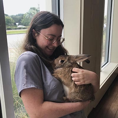 Staff Member Cuddling Rabbit